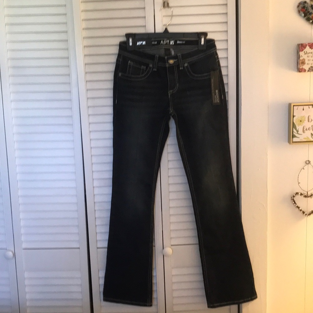 Apt. 9 Boot Cut Dark blue Bdenim with slight fading in front only.